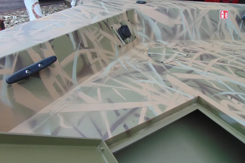 Slide: The Image of 2026 CRESTLINIER 1860 Retriever Deluxe Tiller with camouflage pattern and deck details. - 14