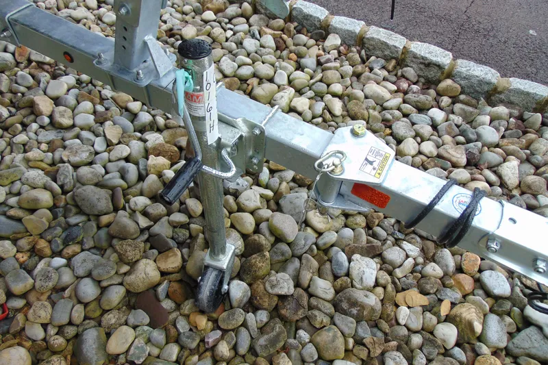 Slide: The Image of Trailer hitch of 2026 CRESTLINIER 1860 Retriever Deluxe Tiller on gravel surface. - 4