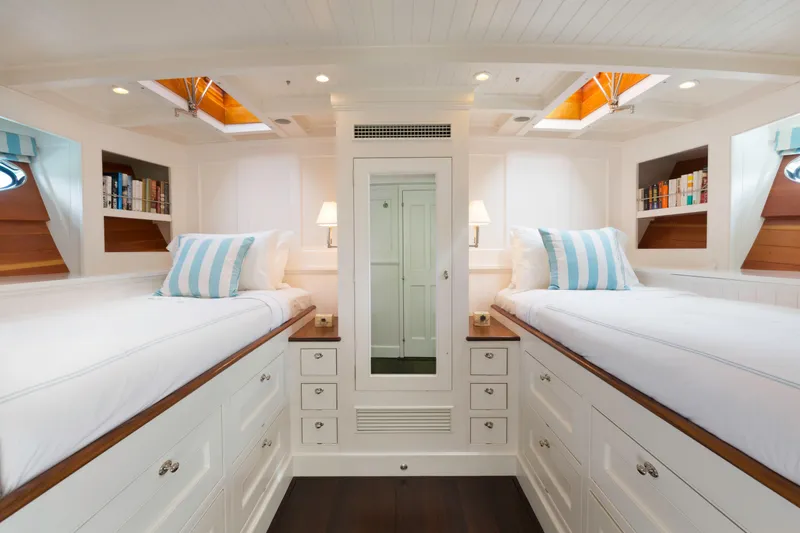 Slide: The Image of Luxurious 2009 Brooklin Boat Yard interior with elegant white and wood design, cozy seating area. - 10