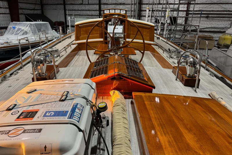 Slide: The Image of Luxurious 2009 Brooklin Boat Yard yacht interior with wooden deck and steering wheel. - 39