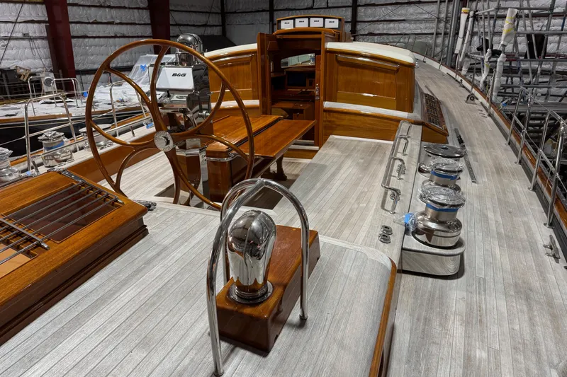 Slide: The Image of 2009 Brooklin Boat Yard model with wooden deck and steering wheel in a workshop. - 42