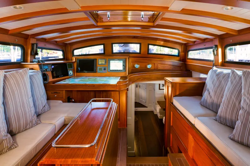 Slide: The Image of Luxurious 2009 Brooklin Boat Yard interior with wood finish, navigation system, and cozy seating. - 6