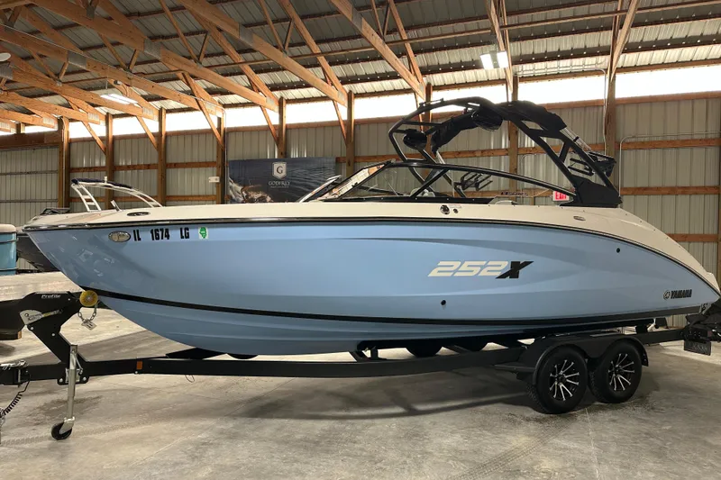 Slide: The Image of 2024 Yamaha Boats 252XE in a warehouse, showcasing sleek design and modern features. - 3