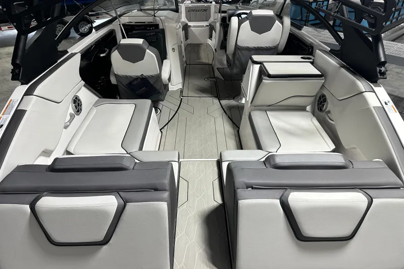 Slide: The Image of 2024 Yamaha Boats 252XE interior, featuring sleek seating and modern design elements. - 7