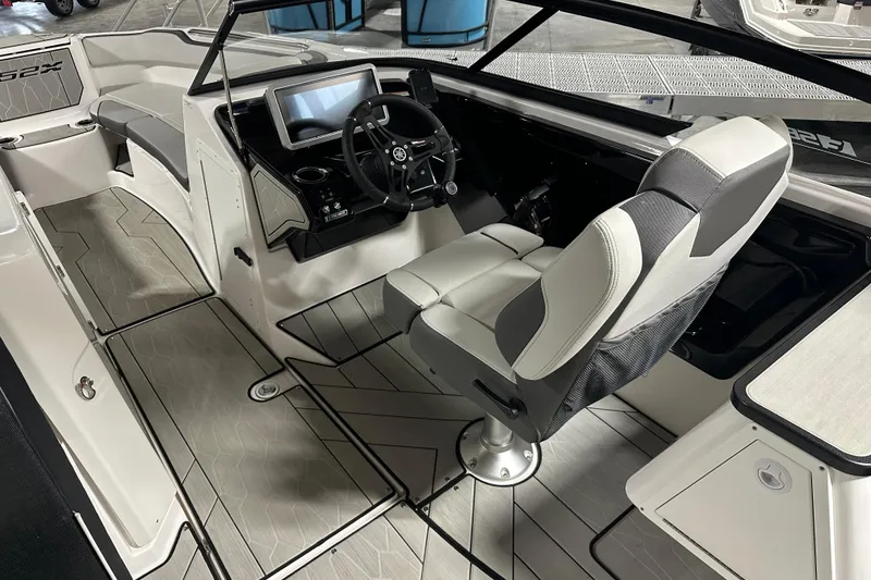 Slide: The Image of 2024 Yamaha Boats 252XE interior with modern helm and seating. - 9
