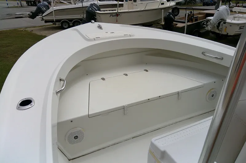 Slide: The Image of 2016 Parker 2100 Special Edition boat interior with storage and seating area. - 12