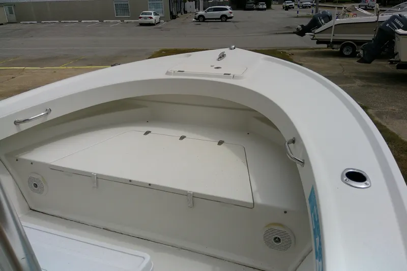 Slide: The Image of 2016 Parker 2100 Special Edition boat, white interior, docked in a parking area. - 14