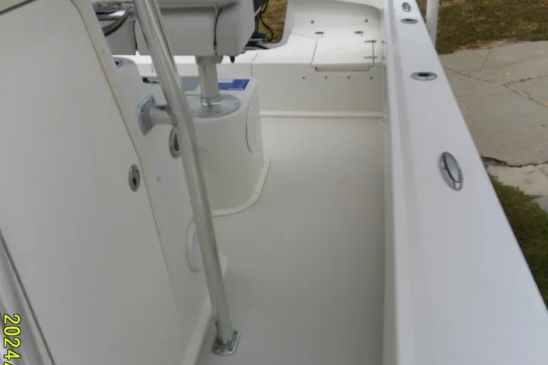 Slide: The Image of 2016 Parker 2100 Special Edition boat interior, featuring clean white deck and seating area. - 18