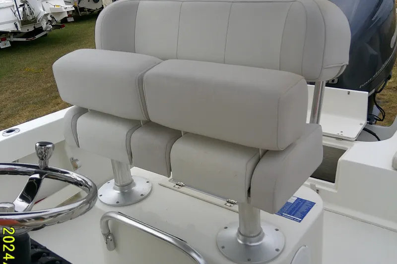 Slide: The Image of 2016 Parker 2100 Special Edition boat with dual cushioned seats and steering wheel. - 29