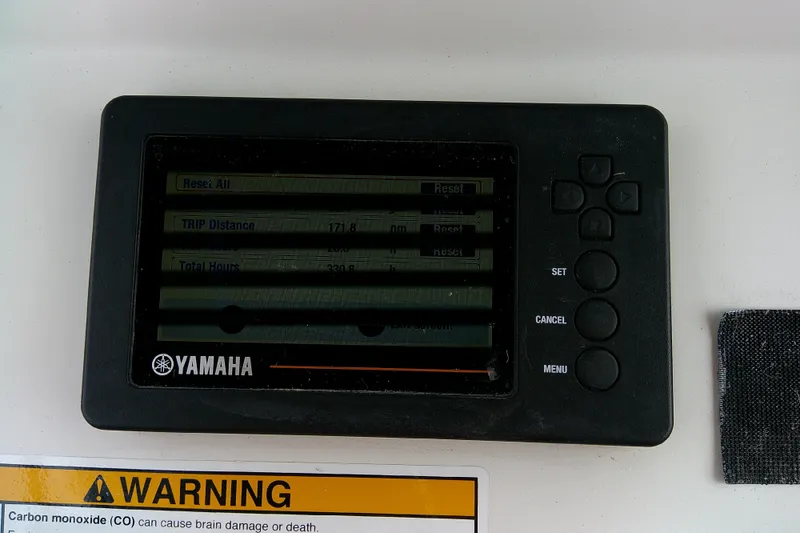 Slide: The Image of Yamaha display panel on 2016 Parker 2100 Special Edition boat with warning label. - 36