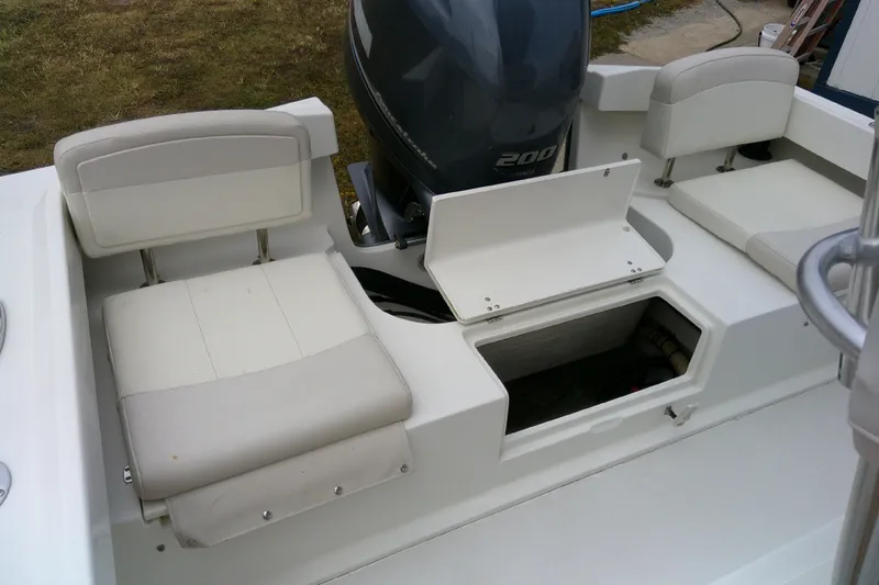 Slide: The Image of 2016 Parker 2100 Special Edition boat interior with seating and storage compartments. - 37