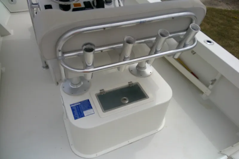 Slide: The Image of 2016 Parker 2100 Special Edition boat interior with rod holders and storage compartment. - 38