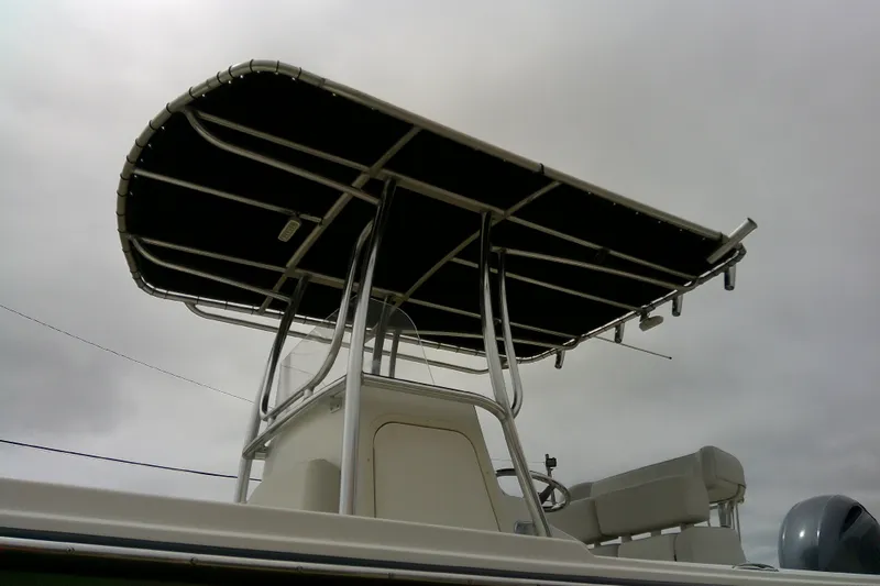 Slide: The Image of 2016 Parker 2100 Special Edition boat with T-top against cloudy sky. - 5