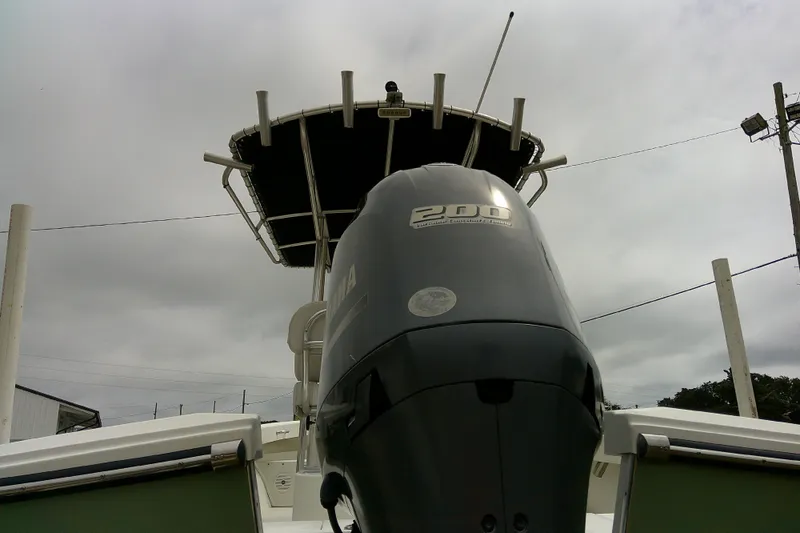 Slide: The Image of 2016 Parker 2100 Special Edition boat with Yamaha 200 outboard motor under cloudy sky. - 7