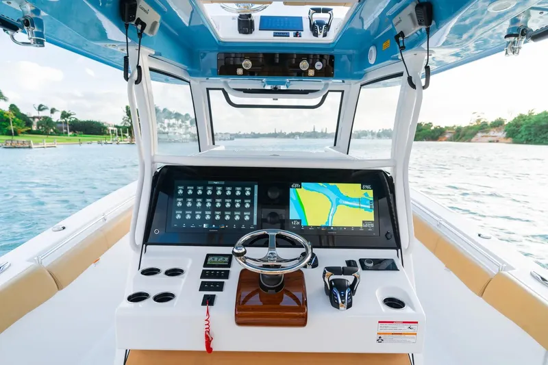 Slide: The Image of 2026 Sportsman Open 352 Center Console boat dashboard with navigation screens on open water. - 10