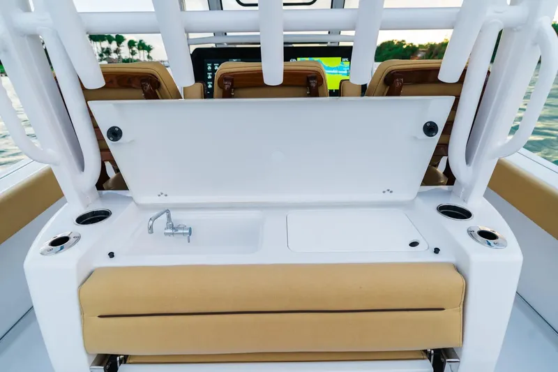 Slide: The Image of 2026 Sportsman Open 352 Center Console boat interior with sink and seating. - 25