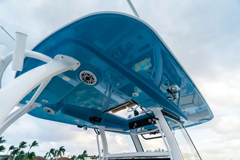 Slide: The Image of 2026 Sportsman Open 352 Center Console boat, blue T-top, speakers, and equipment visible. - 8