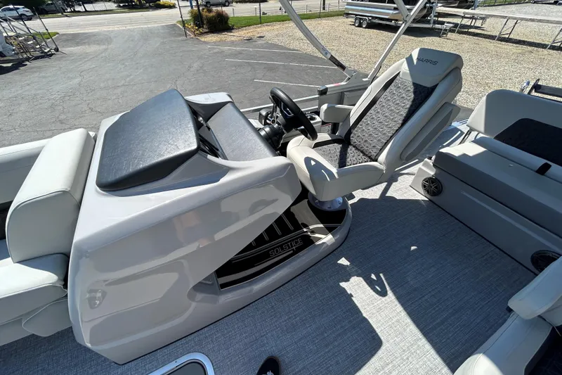 Slide: The Image of 2026 Harris FloteBote 250 Solstice SLDH boat interior with modern helm and seating. - 10