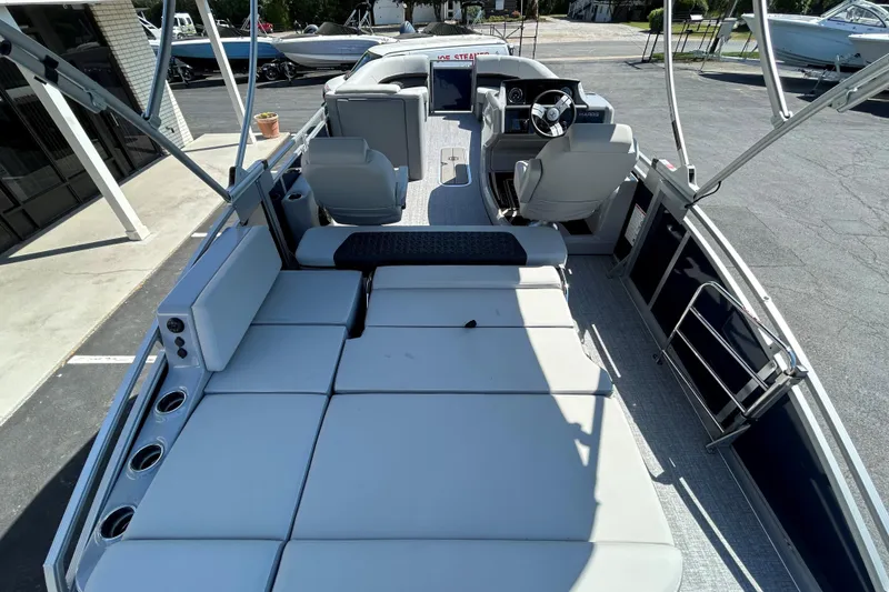 Slide: The Image of 2026 Harris FloteBote 250 Solstice SLDH pontoon boat interior with spacious seating and modern helm. - 12