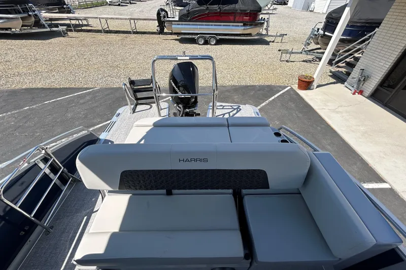 Slide: The Image of 2026 Harris FloteBote 250 Solstice SLDH pontoon boat with spacious seating and modern design. - 14