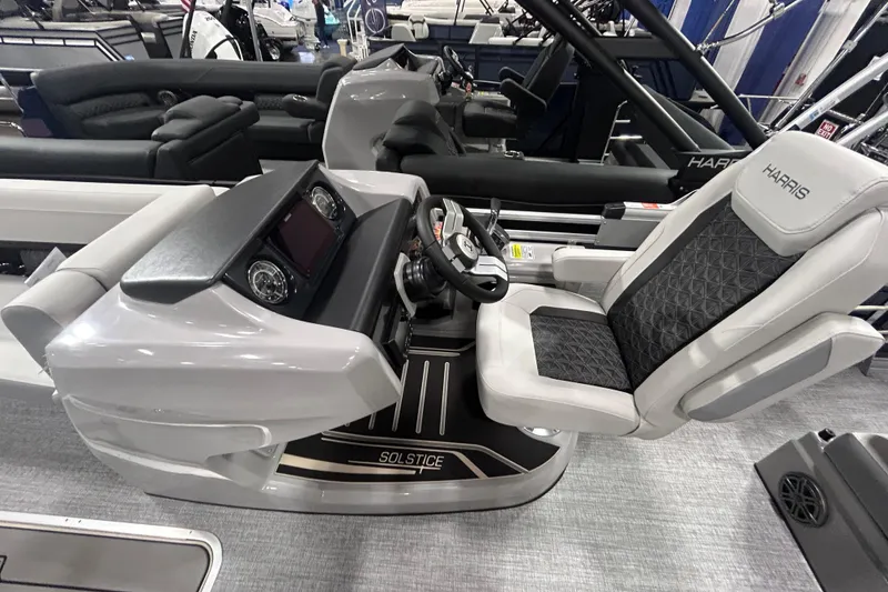Slide: The Image of 2026 Harris FloteBote 250 Solstice SLDH boat interior with modern helm and seating. - 5
