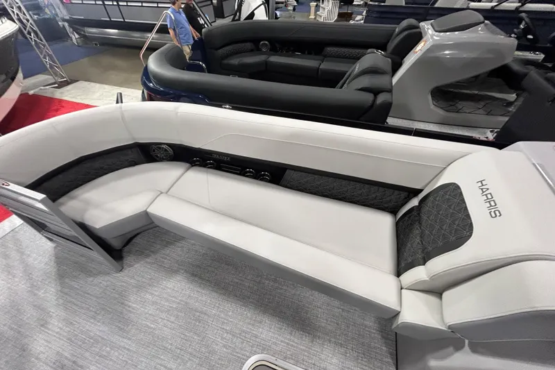 Slide: The Image of 2026 Harris FloteBote 250 Solstice SLDH luxury boat interior with plush seating. - 7