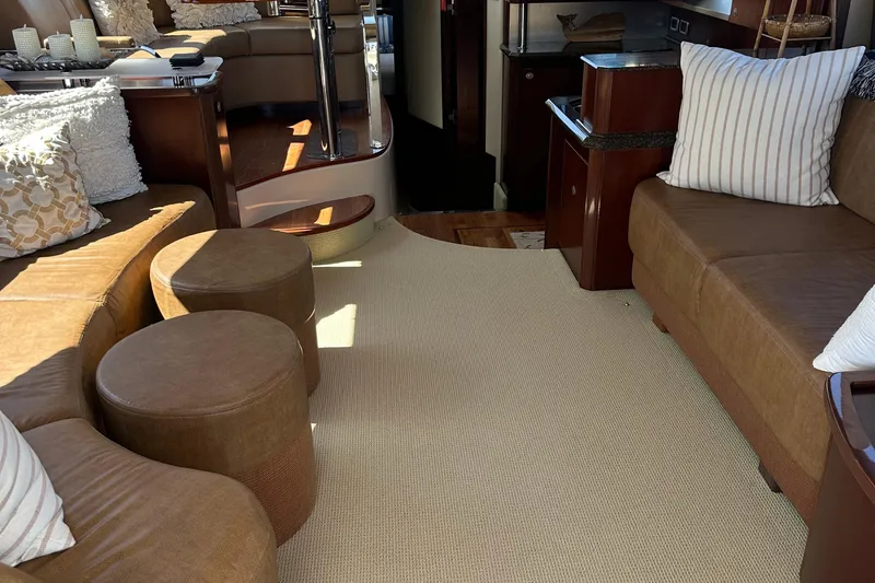 Slide: The Image of Luxurious interior of 2005 Sea Ray 500 Sedan Bridge with plush seating and elegant decor. - 11