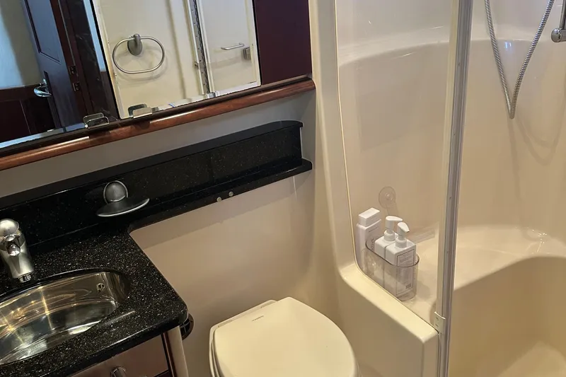 Slide: The Image of Bathroom of 2005 Sea Ray 500 Sedan Bridge yacht with shower and sink. - 21