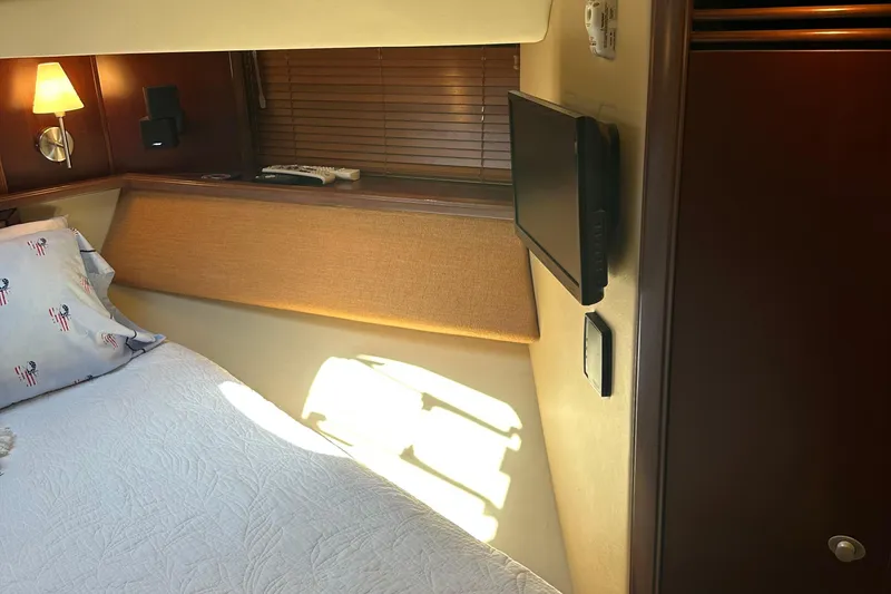 Slide: The Image of Cozy bedroom interior of 2005 Sea Ray 500 Sedan Bridge yacht. - 24