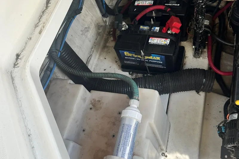 Slide: The Image of Engine compartment of 2006 Sea Ray 260 Sundancer with batteries and wiring visible. - 27