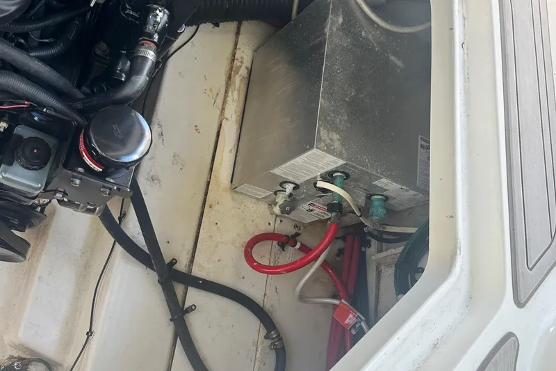 Slide: The Image of Engine compartment of a 2006 Sea Ray 260 Sundancer with visible wiring and components. - 31