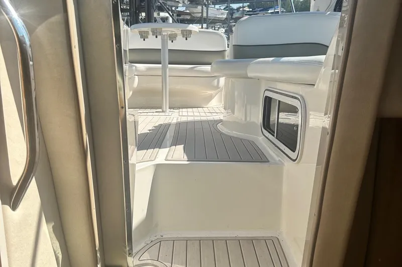Slide: The Image of Interior view of 2006 Sea Ray 260 Sundancer boat with seating and table. - 32