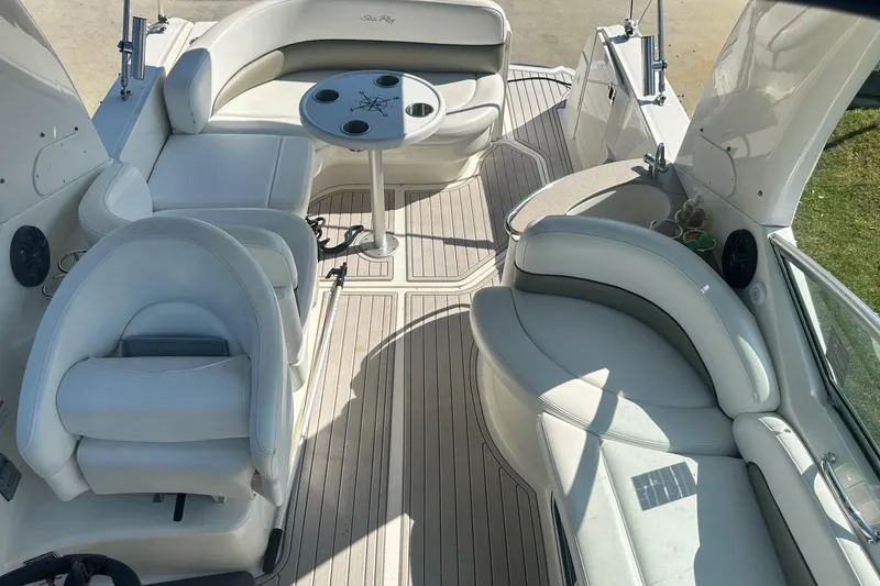 Slide: The Image of 2006 Sea Ray 260 Sundancer boat interior with white seating and table. - 38