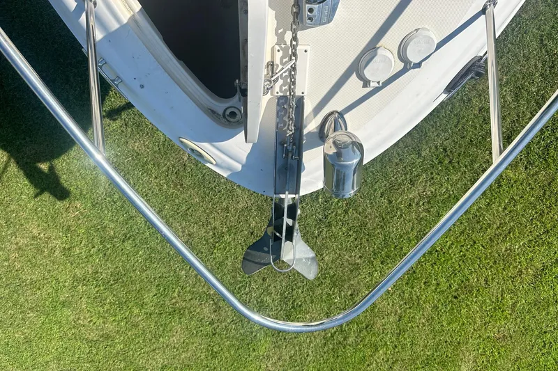 Slide: The Image of Bow view of a 2006 Sea Ray 260 Sundancer with anchor and railing. - 59