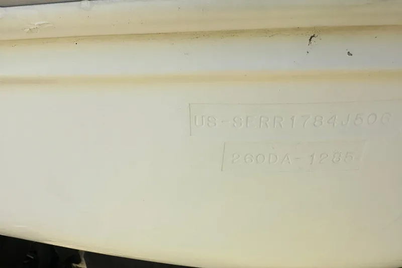Slide: The Image of 2006 Sea Ray 260 Sundancer hull identification number on white surface. - 8