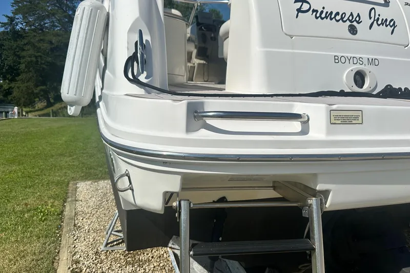 Slide: The Image of 2006 Sea Ray 260 Sundancer boat stern with ladder, named "Princess Jing," docked in Boyds, MD. - 9