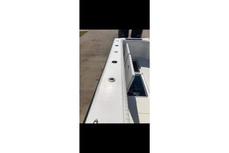 Slide: The Image of Freeman 37 VH 2016 boat dashboard with navigation screens and controls. - 10