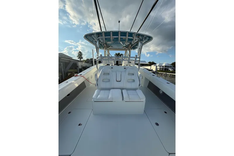 Slide: The Image of Freeman 37 VH 2016 boat interior with white seating and blue sky background. - 16