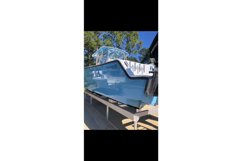 Slide: The Image of Freeman 37 VH 2016 boat docked, showcasing spacious deck and sleek design. - 2