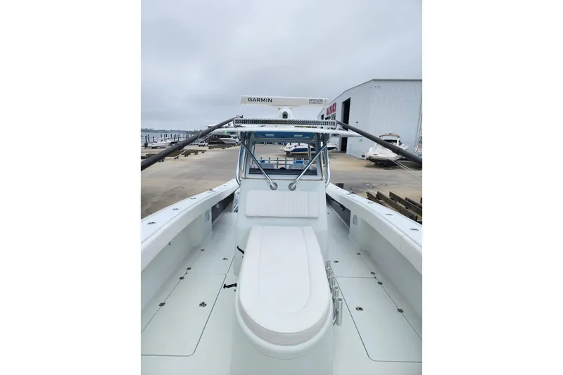 Slide: The Image of Freeman 37 VH 2016 boat docked, featuring Garmin equipment, with a scenic waterfront view. - 4