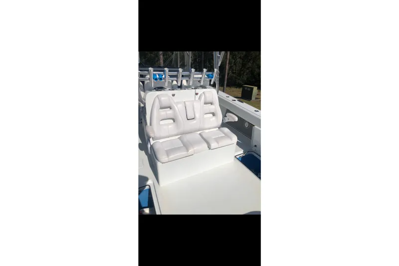 Slide: The Image of Freeman 37 VH 2016 boat with Garmin navigation, docked under a sunny sky. - 8