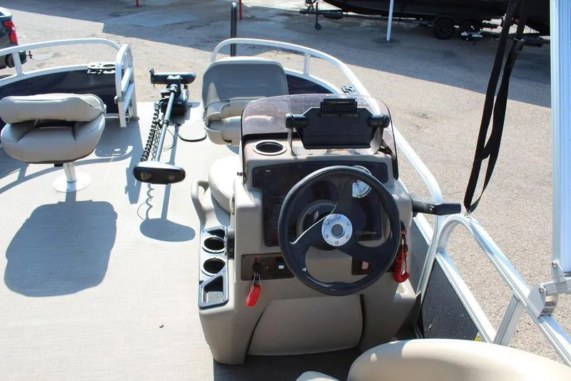 Slide: The Image of 2020 Sun Tracker BASS BUGGY® 16 DLX pontoon boat interior with steering console. - 12