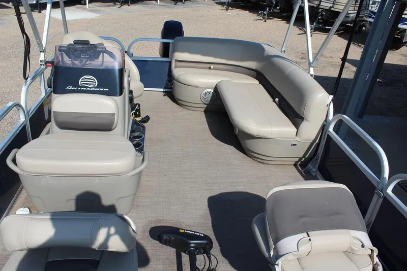 Slide: The Image of 2020 Sun Tracker BASS BUGGY® 16 DLX pontoon boat interior with seating and console. - 9