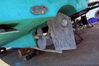 Slide: The Image of 2004 Mainship Pilot 34 boat hull and propeller on dry dock. - 6
