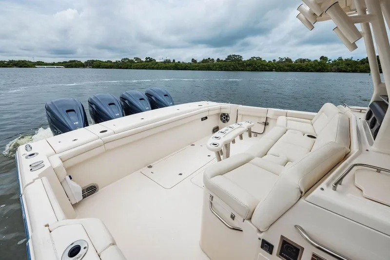Slide: The Image of 2022 Grady-White Canyon 456 boat with spacious seating and four powerful engines. - 11