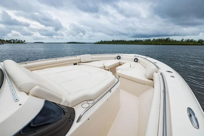 Slide: The Image of 2022 Grady-White Canyon 456 boat with spacious seating on a calm waterway. - 28