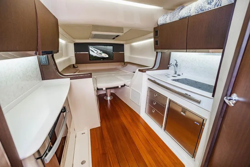 Slide: The Image of Luxurious interior of 2022 Grady-White Canyon 456 boat with modern kitchen and seating area. - 34