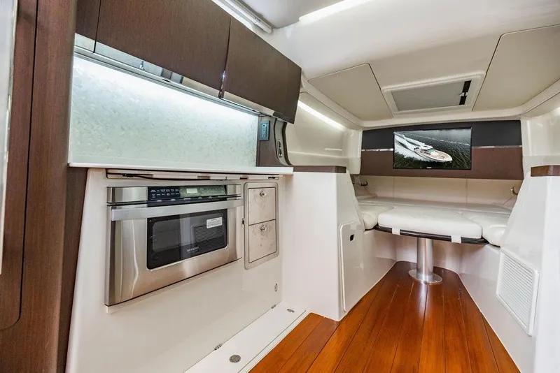 Slide: The Image of Luxurious interior of 2022 Grady-White Canyon 456 boat with modern amenities and seating. - 36