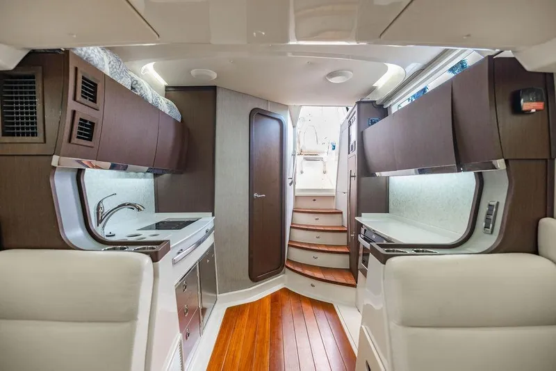 Slide: The Image of Luxurious interior of 2022 Grady-White Canyon 456 boat with modern kitchen and wooden flooring. - 38