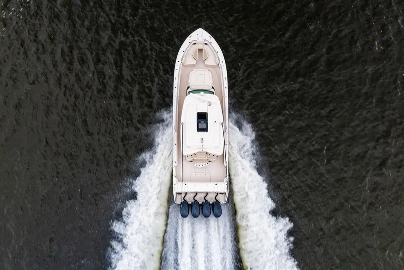 Slide: The Image of Aerial view of 2022 Grady-White Canyon 456 boat cruising on water. - 8